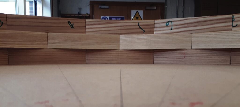 Wooden construction blocks with green markings