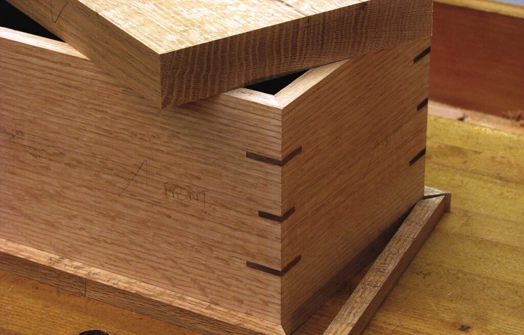 Wooden box with dovetail joints on table