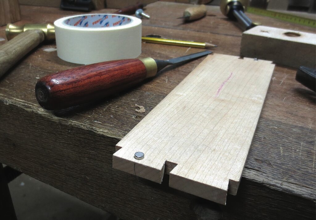 Woodworking tools on wooden workspace table.