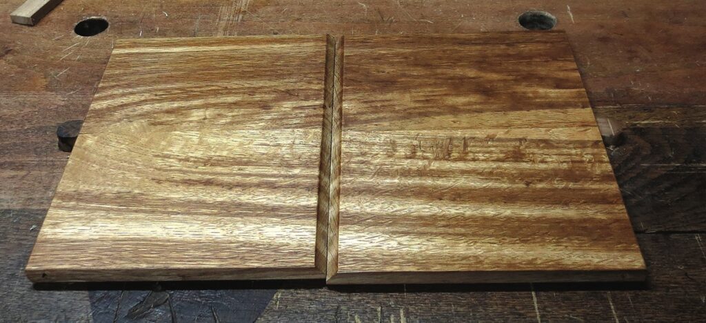 Wooden boards with groove joint detail.