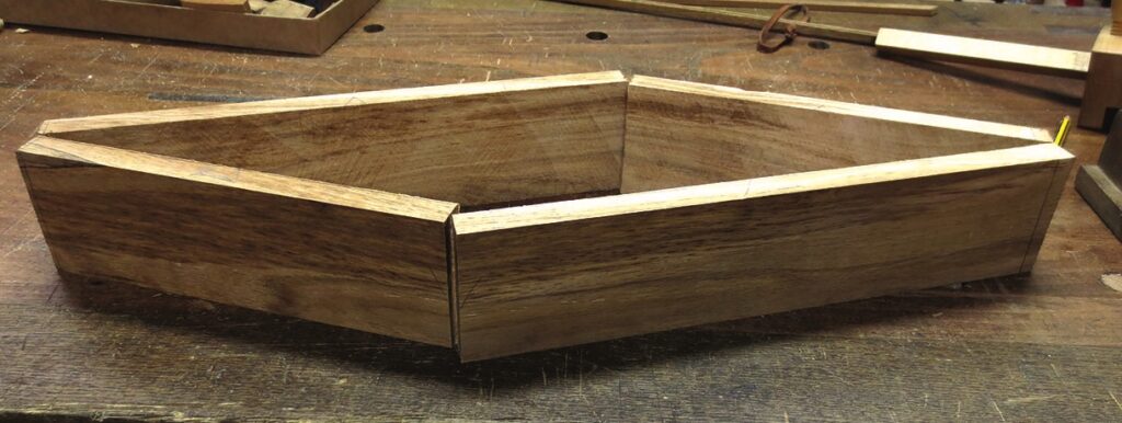 Wooden box joint on workbench