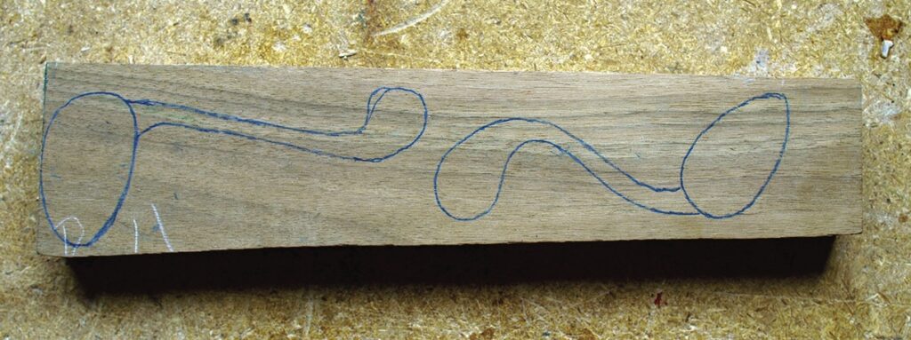 Wood block with drawn spoon outlines