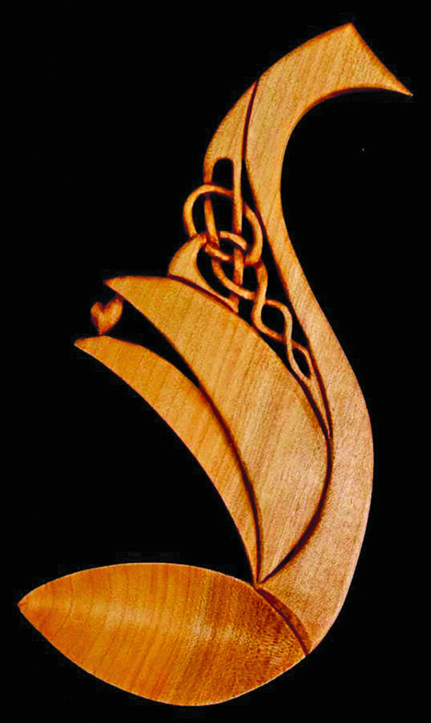 Intricate wooden carved lovespoon design