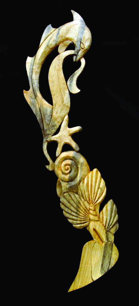 Intricate wooden carving of marine life.