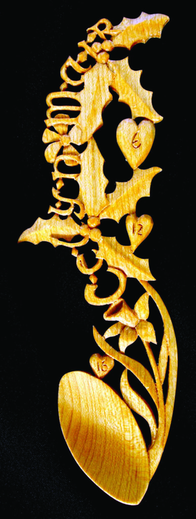 Intricate wooden souvenir spoon carving