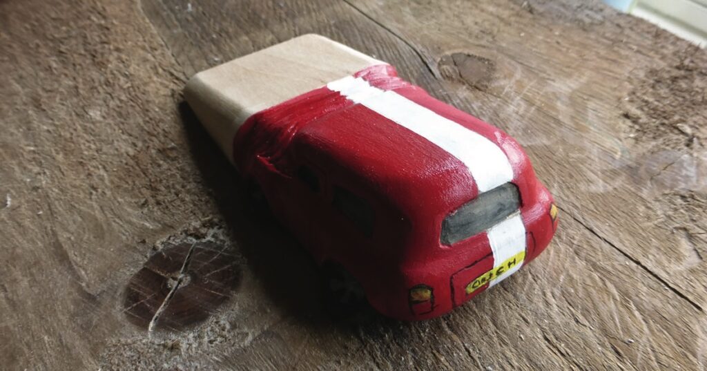 Toy car soap on wooden surface