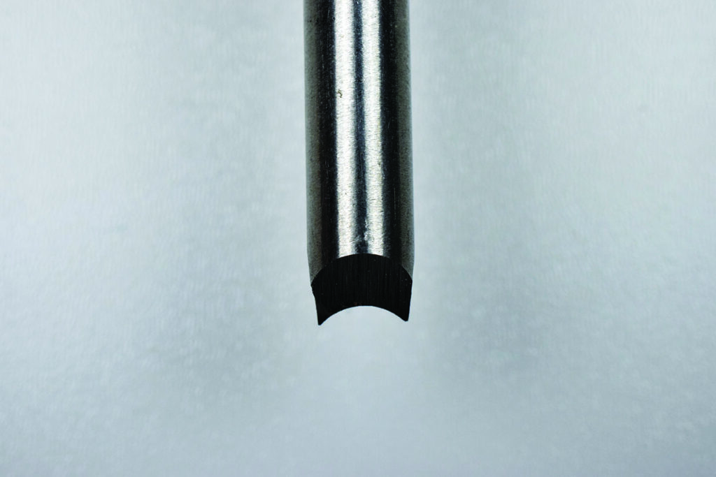 Close-up of a half-round bit drill