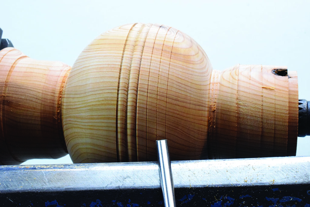 Woodturning a wooden bowl on a lathe.