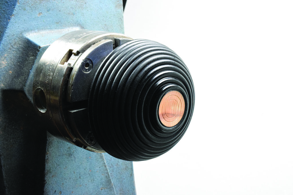 Close-up of black ribbed machinery component.