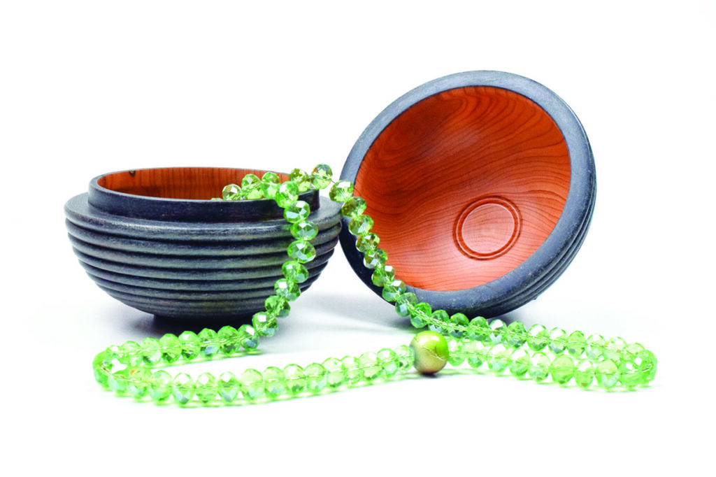 Green beaded necklace in wooden box