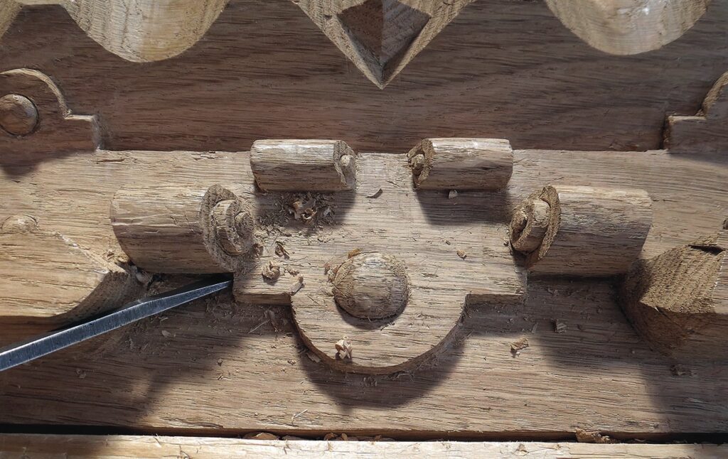 Close-up of detailed wood carving in progress