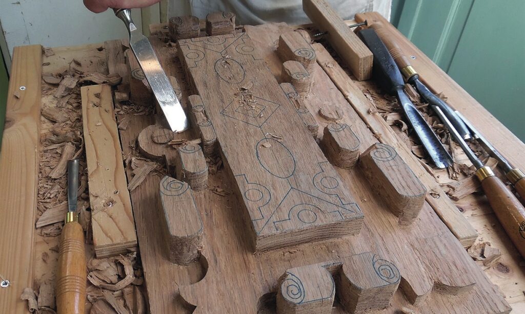 Wood carving with intricate designs and chisels