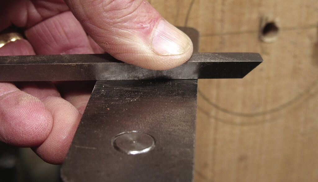 Finger testing precision on metal tool edge