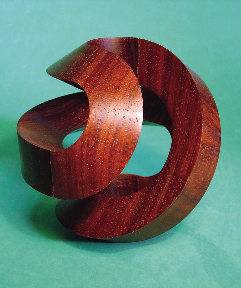 Wooden sculpture with abstract circular design