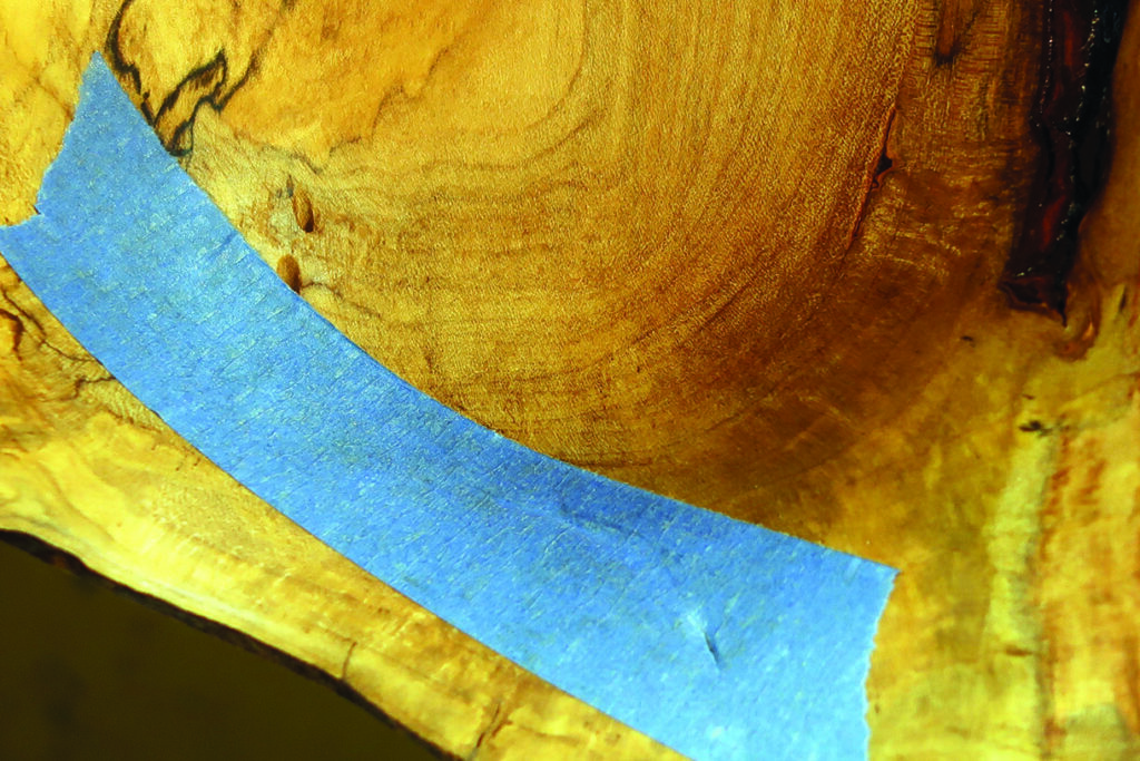 Blue tape on wooden surface texture