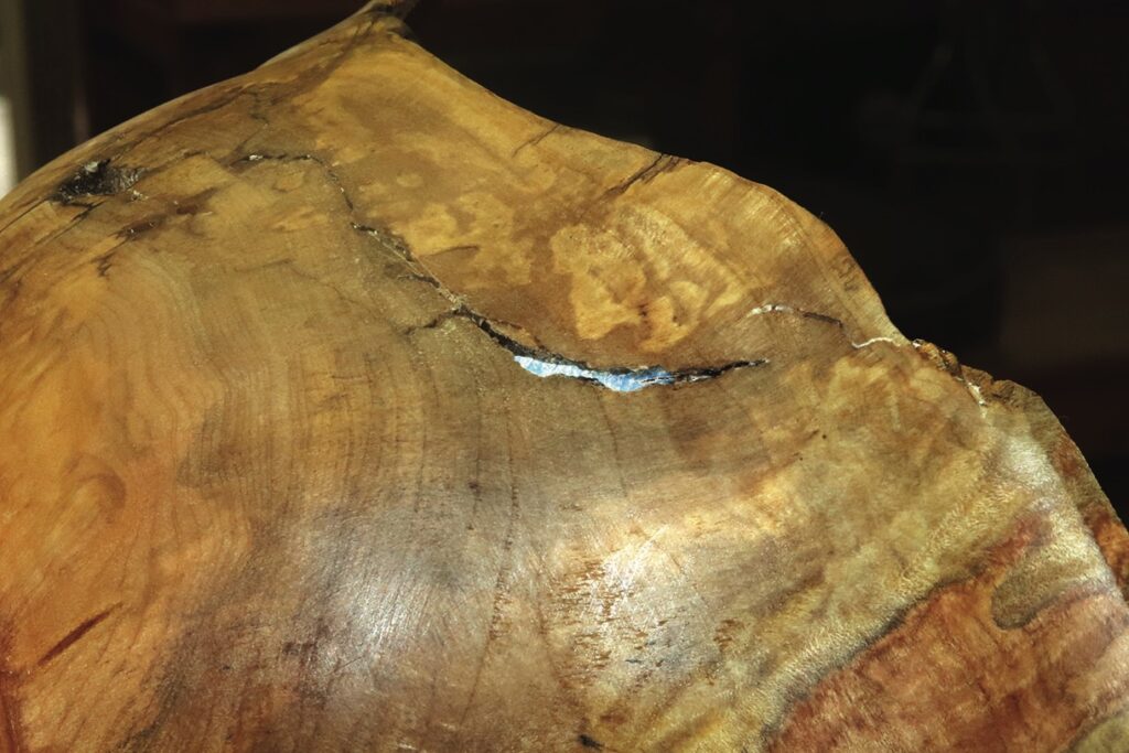 Close-up of cracked wooden surface texture