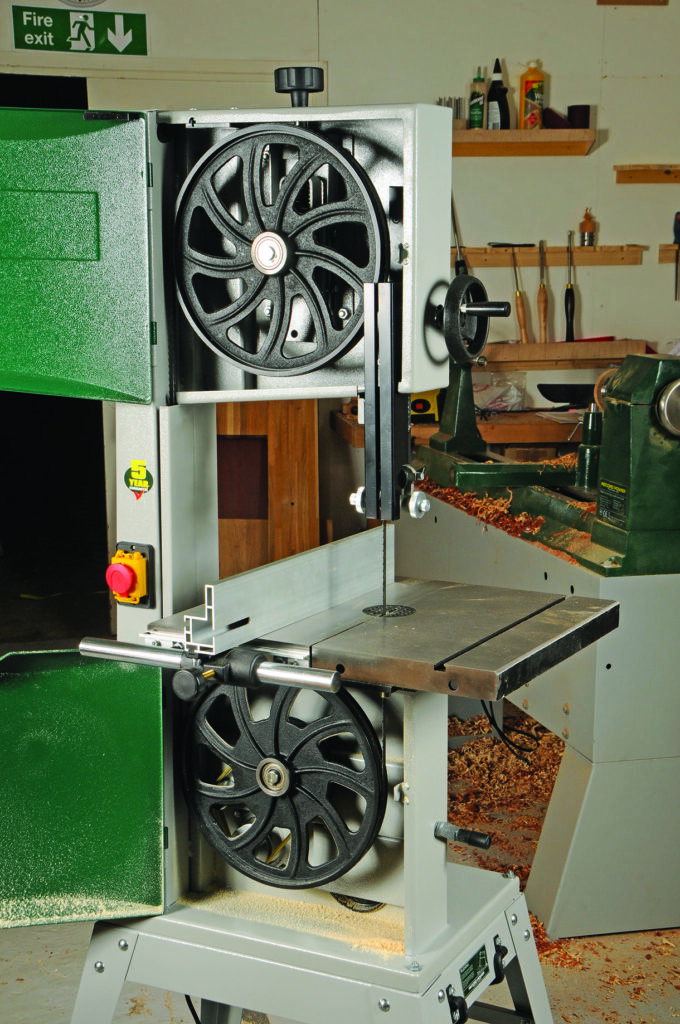 Industrial band saw in a workshop setting