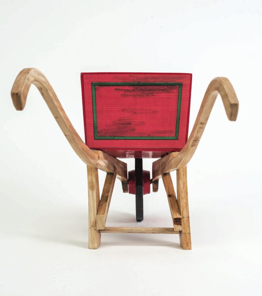 Front view of decorative wooden wheelbarrow