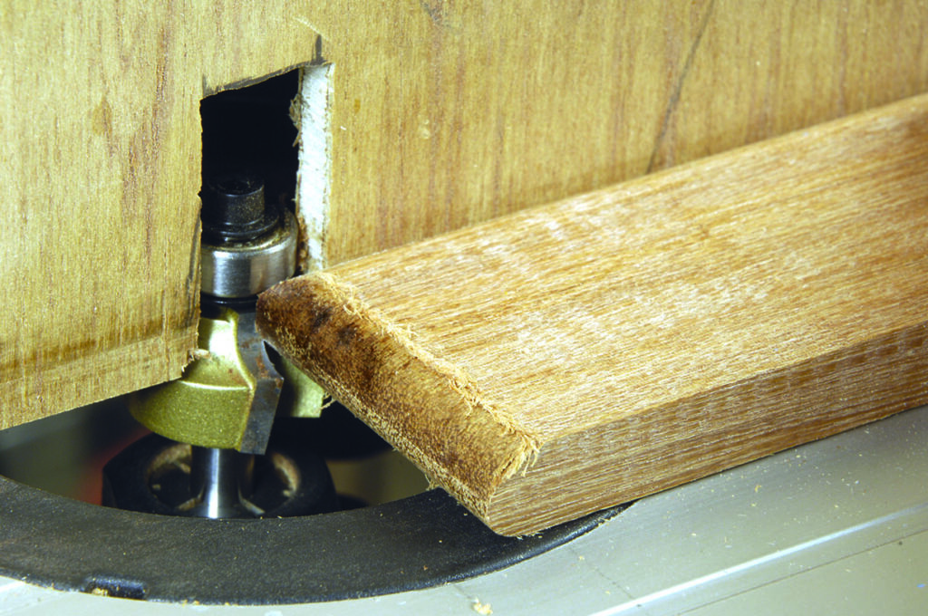Router cutting wood for joint.