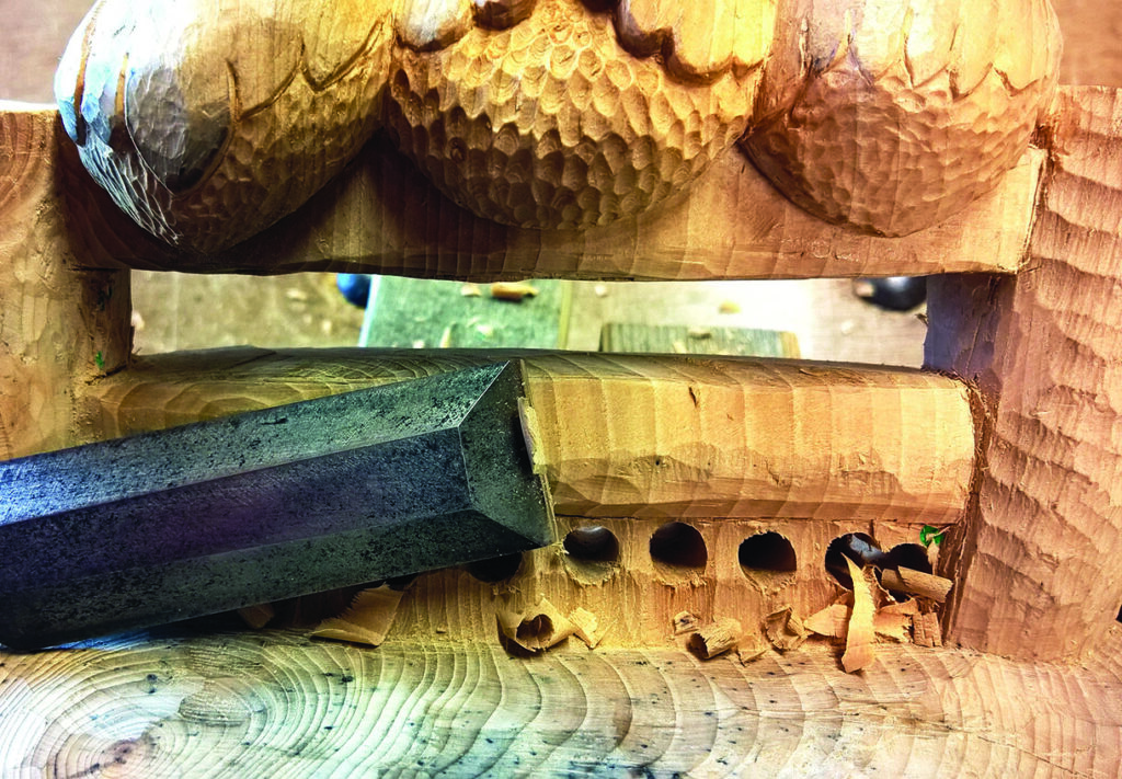 Close-up of a detailed wood carving.