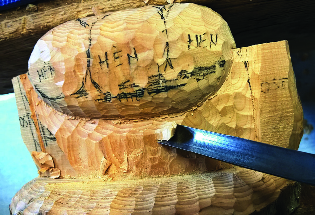 Wood carving with chisel in progress