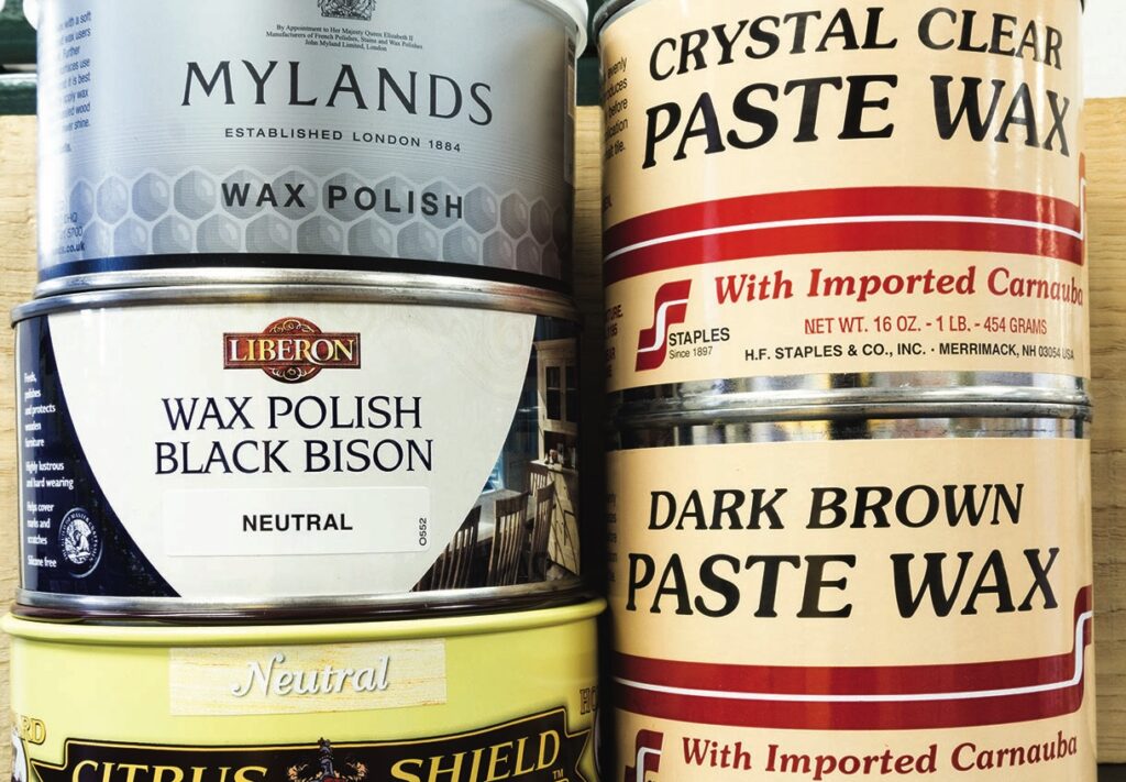 Assorted wax polishes in tins