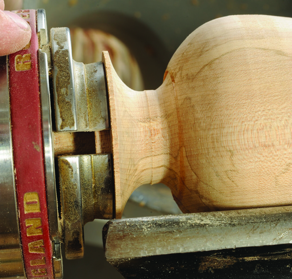 Wood being turned on a lathe machine
