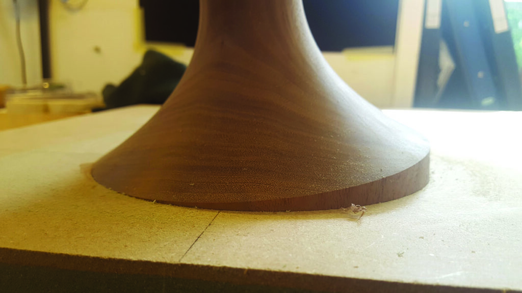 Close-up of smooth wooden table leg.