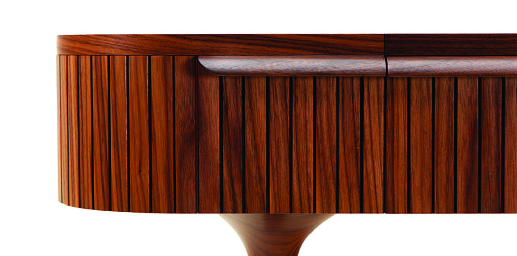 Close-up of wooden table with vertical slats.