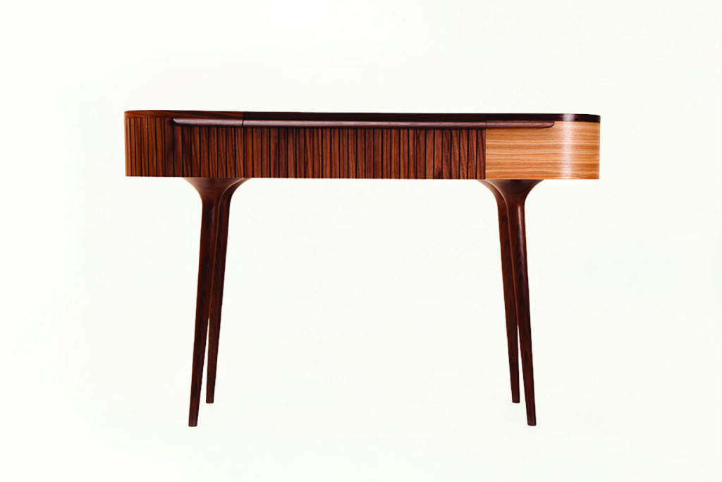 Elegant wooden desk with tapered legs.