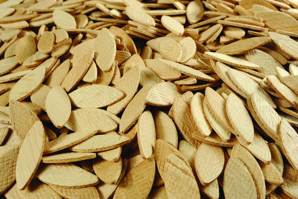 Wooden biscuits for joinery projects on display.