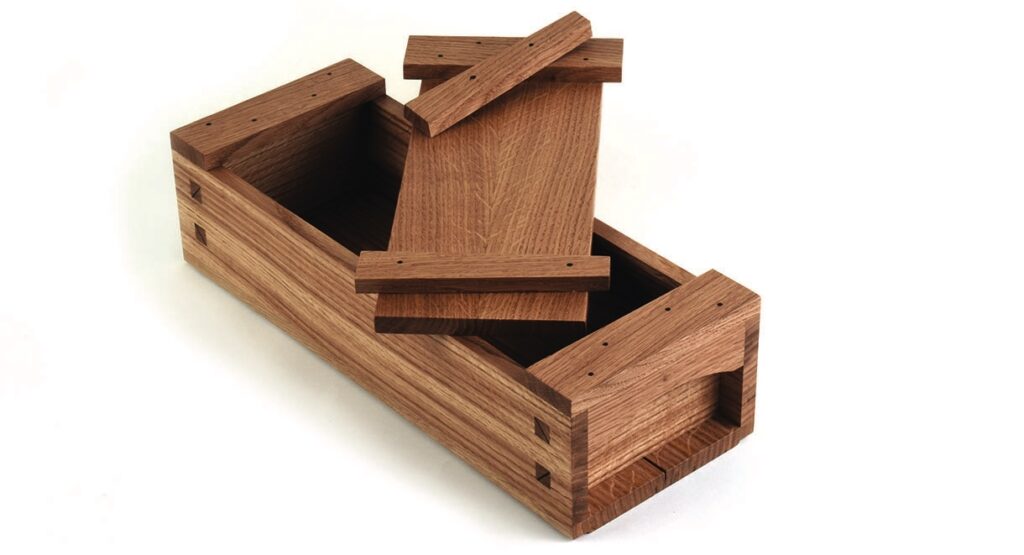 Wooden box with sliding lid.