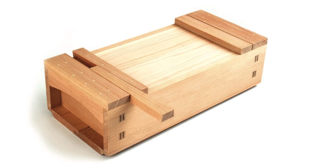 Wooden Japanese toolbox with sliding lid.
