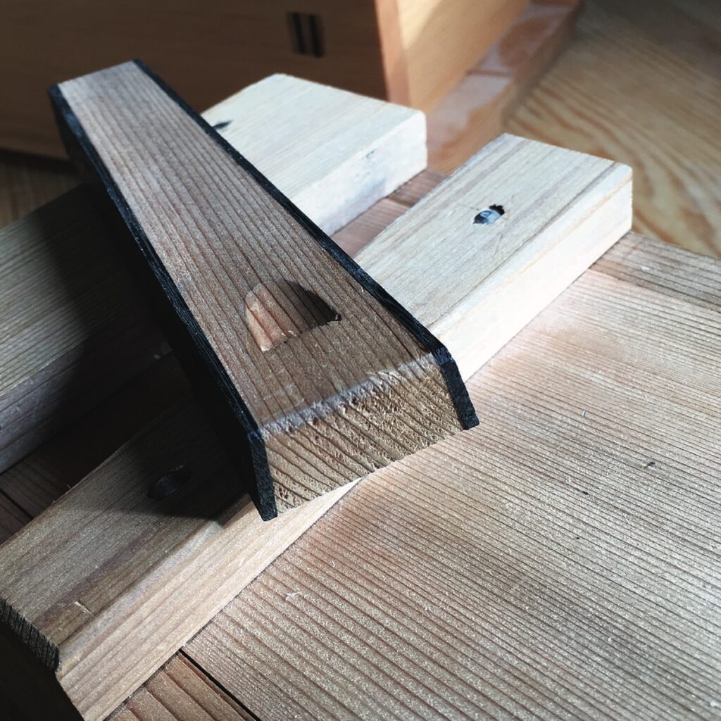 Wooden dovetail joint on a workbench