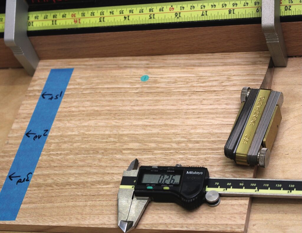 Close-up of measuring tools on wooden surface.