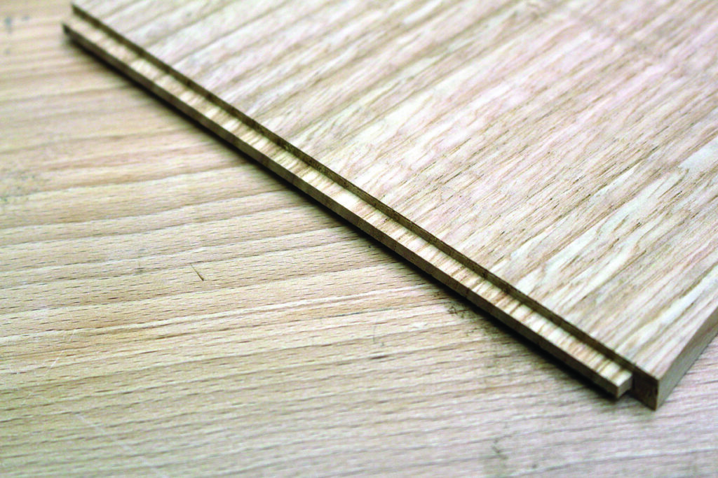 Close-up of wooden laminate flooring panels.