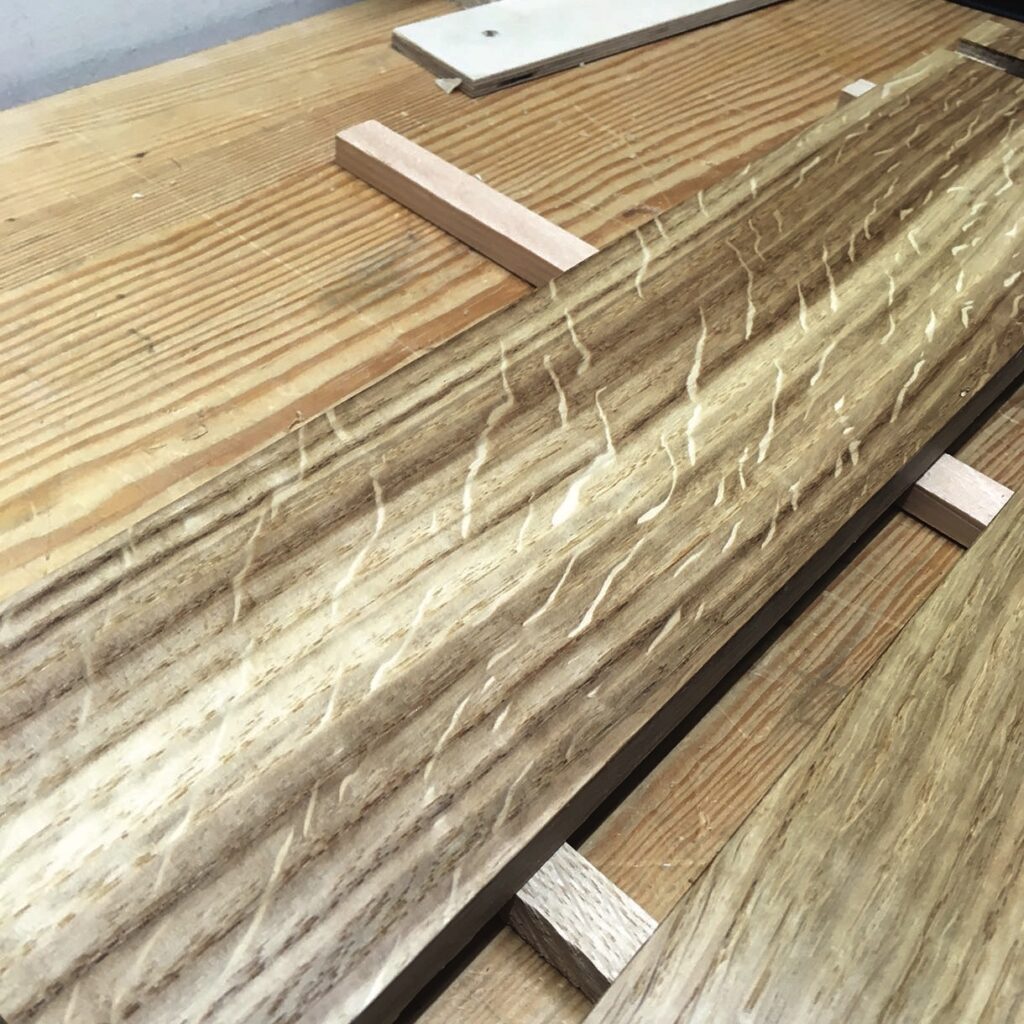 Wooden planks with unique grain patterns on table.