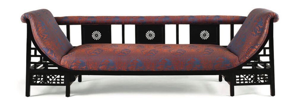 Elegant vintage settee with patterned upholstery.