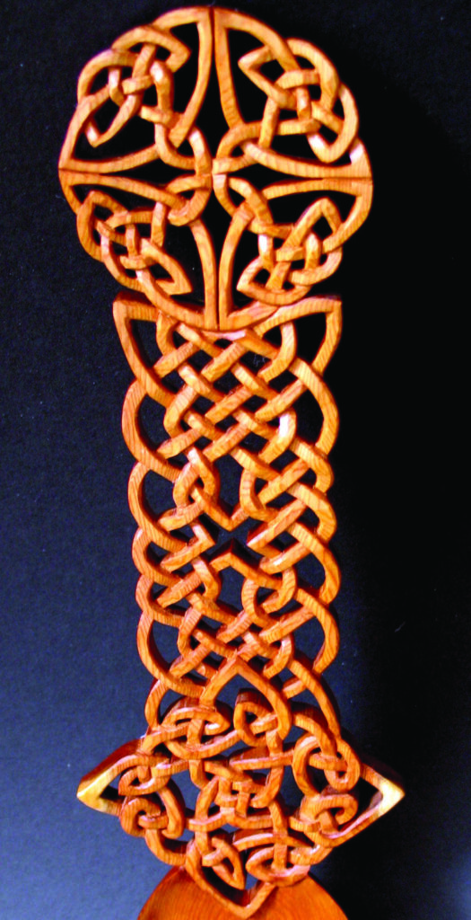 Intricate Celtic knot design on wood carving