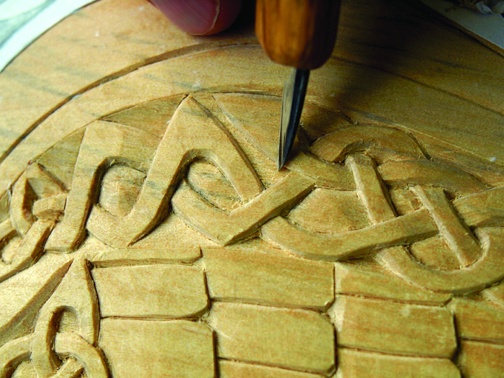 Wood carving with intricate Celtic design.