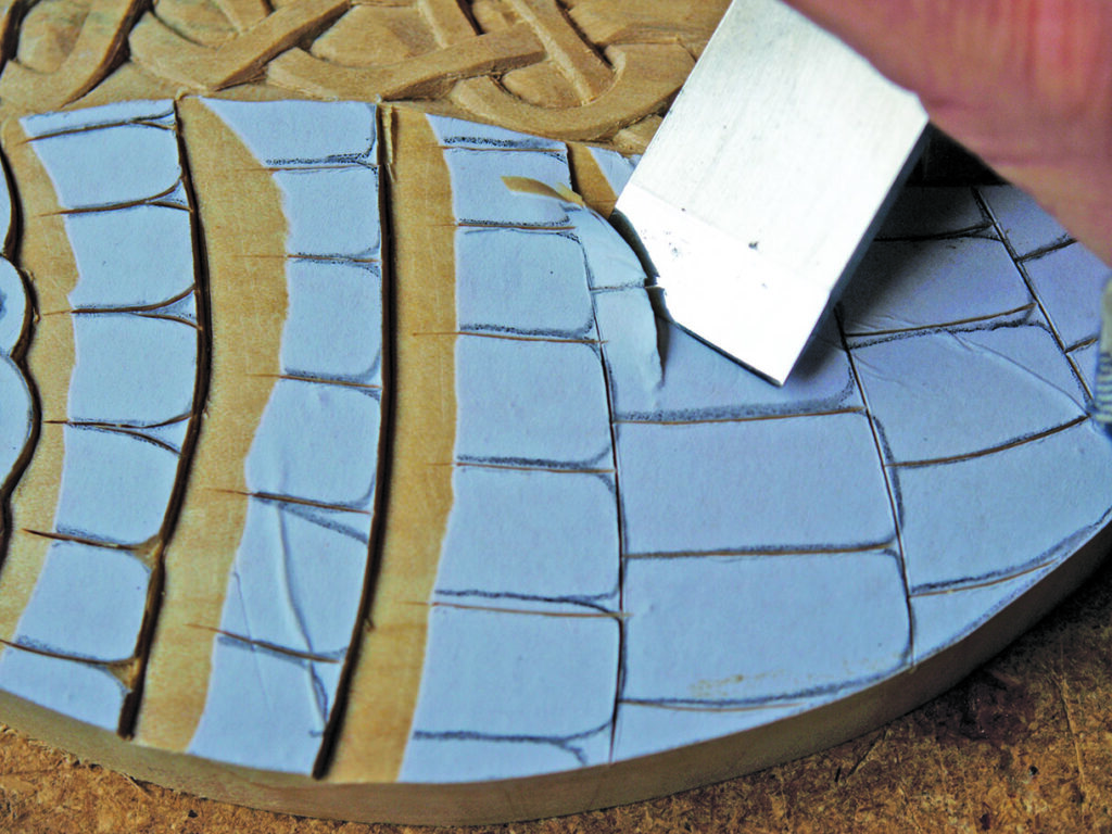 Hand carving blue and brown linocut block