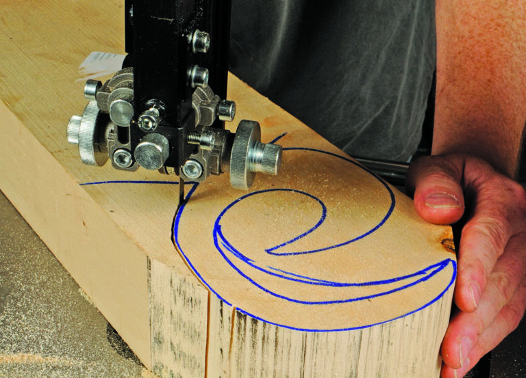 Bandsaw cutting swirl design on wood