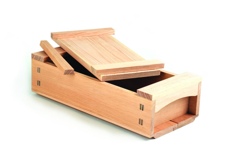 Open wooden puzzle box with sliding lid