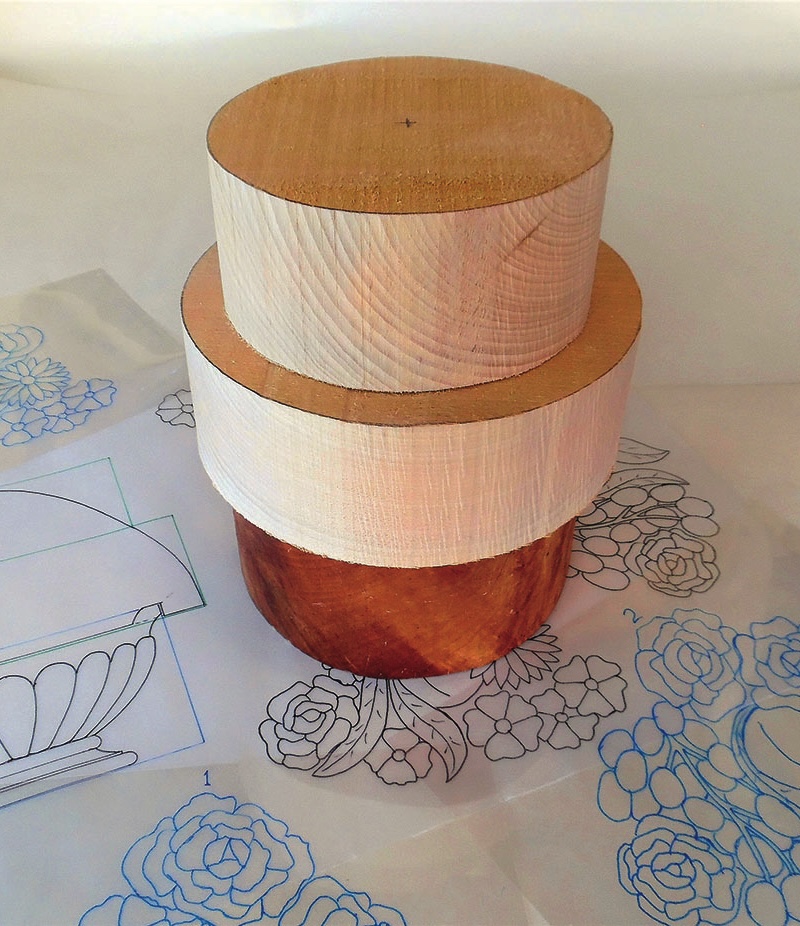 Wooden cake structure on floral design paper.