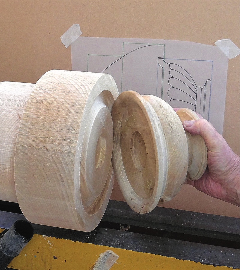 Wood turned columns with carving designs.