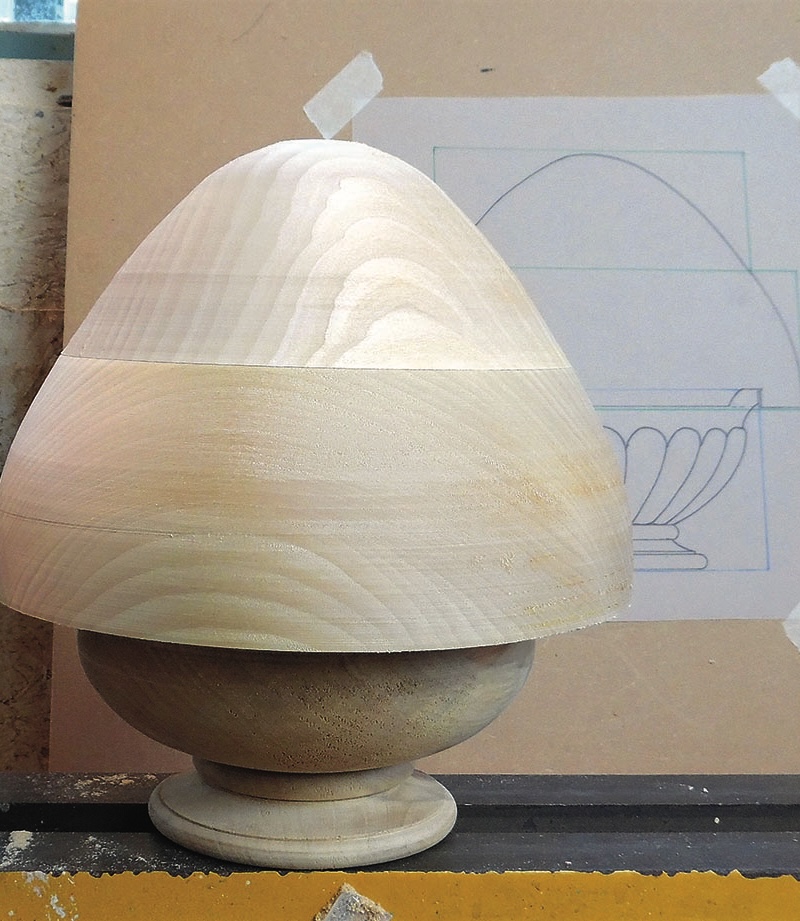 Wooden bowl with drawing in background