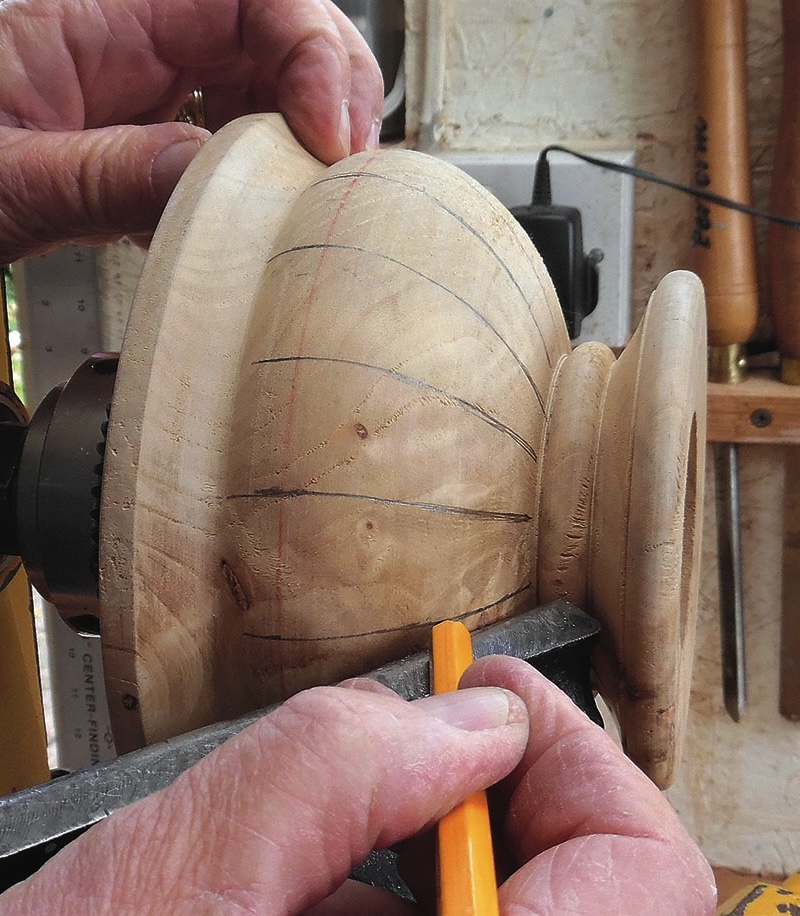 Carpenter marking wood on a lathe.