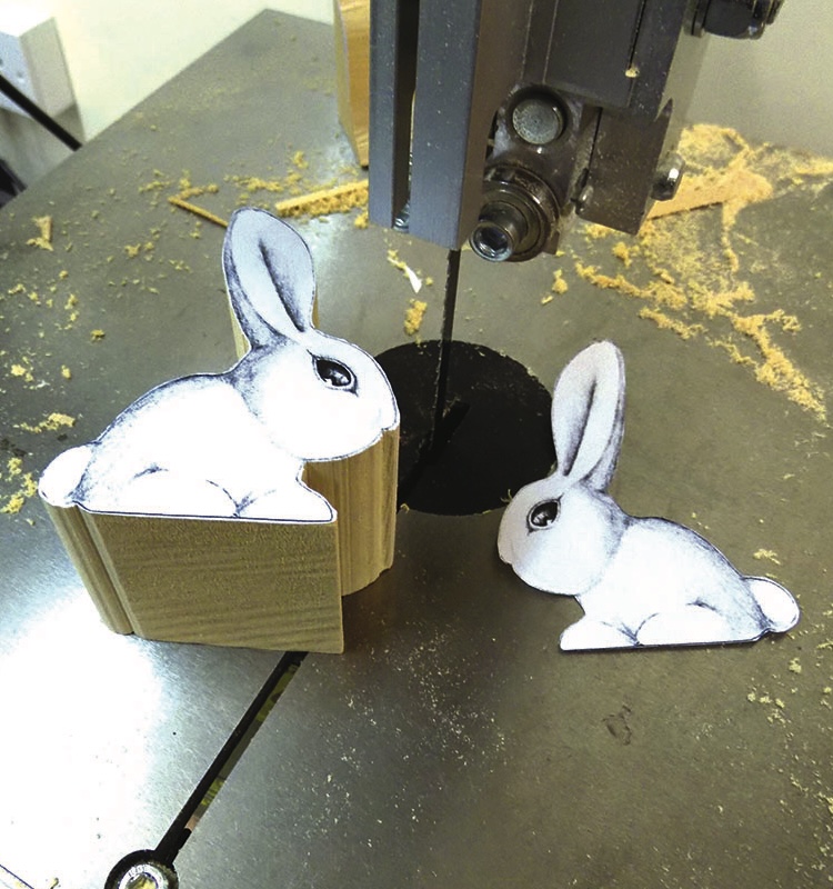 Creative wooden rabbit crafts on saw table.