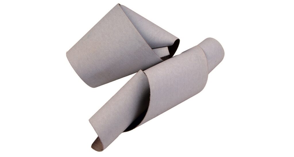 Two rolled abrasive paper sheets, side-by-side.