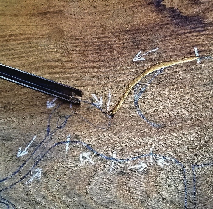 Bark removal in curling wooden grain surface